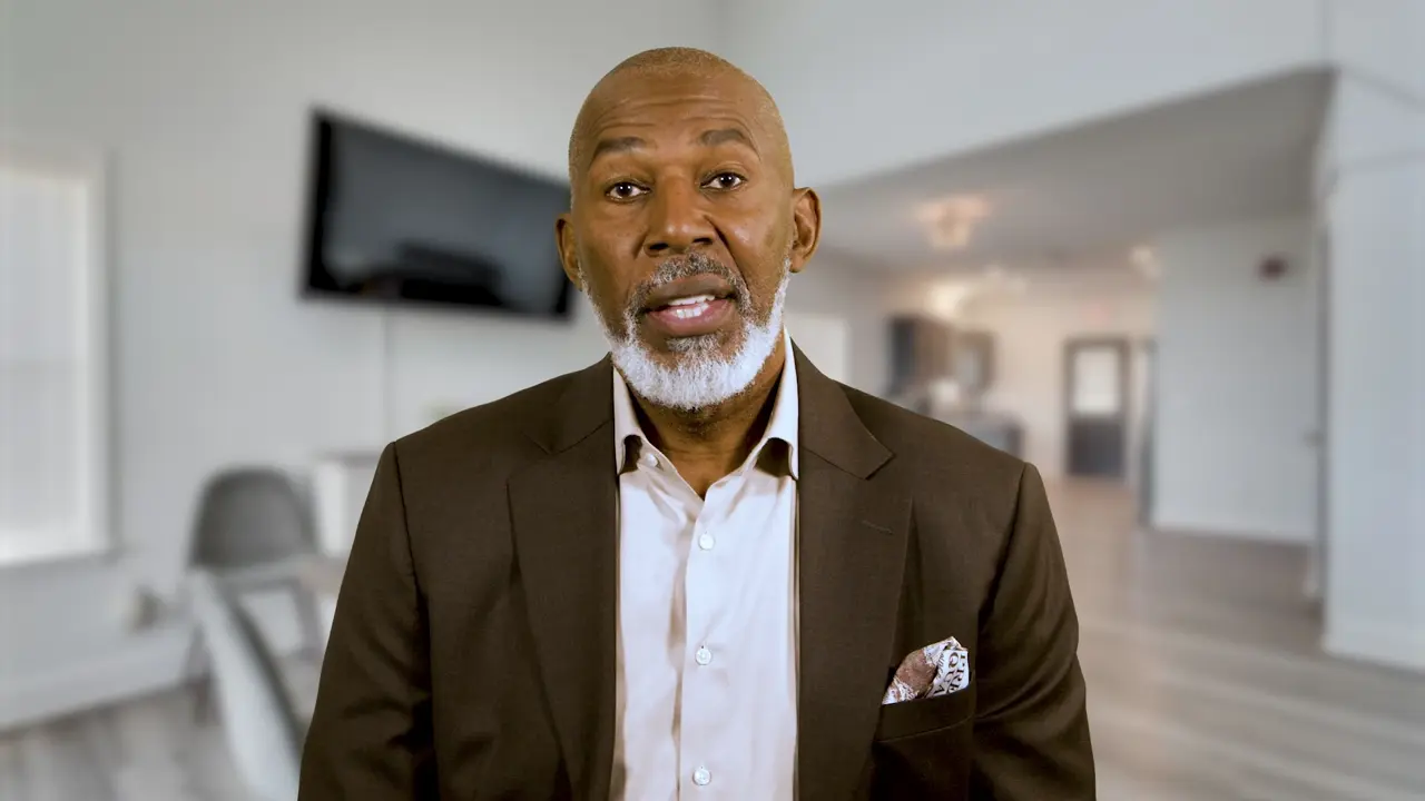 Thurl Bailey speaking on camera in a professional interview setting at Diamond Detox.